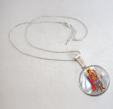 A beautifully handcrafted Saint Michael the Archangel necklace, with a hand-painted icon on a Mother-of-Pearl cabochon and a silver-plated chain.