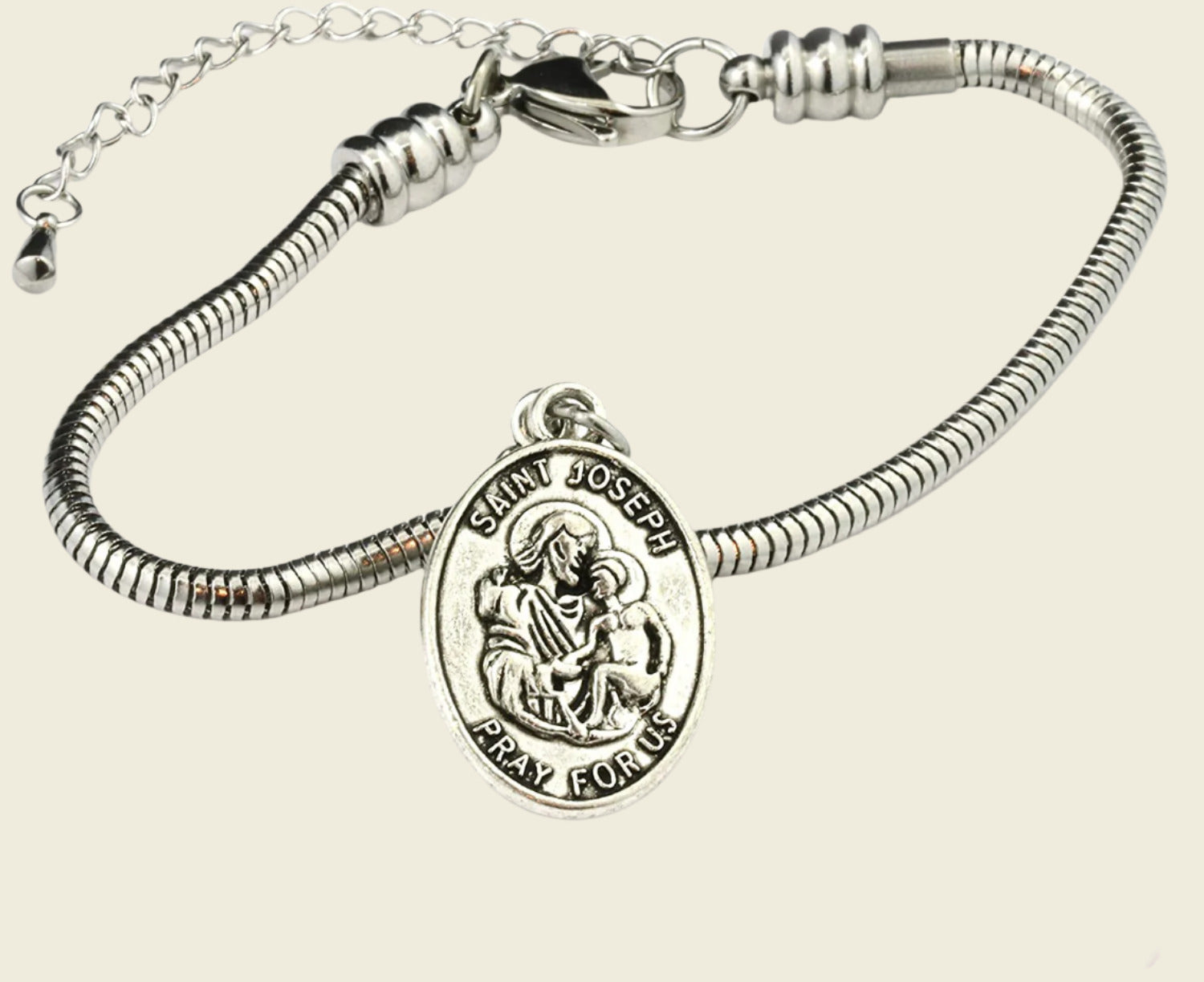 A stainless steel bracelet with a Saint Joseph charm attached to a small chain.