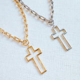 Two cross pendant necklaces on a U-shaped chain, one in gold color and one in silver, displayed against a white background.
