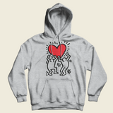 A gray hoodie with a graphic print of two stylized men holding a red heart icon, representing street art style.